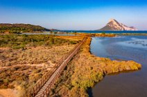 AERIAL ART - wooden footbridge between ponds behind Porto Taverna beach and Isola Tavolara in the back - Sardinia - Italy 01 AERIAL ART - wooden footbridge between ponds behind Porto Taverna beach and Isola Tavolara in the back - Sardinia - Italy 01.jpg