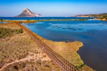 AERIAL ART - wooden footbridge between ponds behind Porto Taverna beach and Isola Tavolara in the back - Sardinia - Italy 03 AERIAL ART - wooden footbridge between ponds behind Porto Taverna beach and Isola Tavolara in the back - Sardinia - Italy 03.jpg