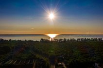 AERIAL ART - view across farm land to the Mediterranean Sea during sunrise - Riposto Archi - Sicily - Italy AERIAL ART - view across farm land to the Mediterranean Sea during sunrise - Riposto Archi - Sicily - Italy.jpg
