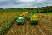 AERIAL ART - CORN HARVEST with corn chopper and tractor and trailer 08 AERIAL ART - CORN HARVEST with corn chopper and tractor and trailer 08.jpg