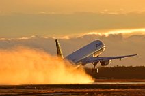 LUFTHANSA AIRBUS A321 TAKING OFF WET RUNWAY DURING SUNSET