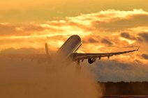 AIR CANADA AIRBUS A330 TAKING OFF ON WET RUNWAY DURING SUNSET 01