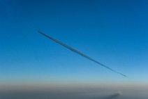 Airliner in blue sky with dark vapor trail 02 Airliner in blue sky with dark vapor trail 02.JPG