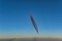 Airliner in blue sky with dark vapor trail 03 Airliner in blue sky with dark vapor trail 03.JPG