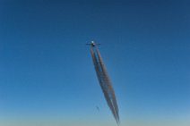 Airliner in blue sky with dark vapor trail 04 Airliner in blue sky with dark vapor trail 04.JPG