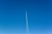 Airliner in blue sky with white vapor trail 01 Airliner in blue sky with white vapor trail 01.JPG