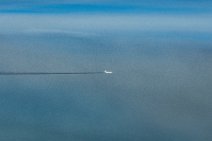 White aircraft with dark vapor trail White aircraft with dark vapor trail.jpg