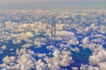 Two engine aircraft with grey vapor trail over clouds Two engine aircraft with grey vapor trail over clouds.jpg