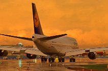 LUFTHANSA BOEING B747-400 D-ABYH TAXIING ON WET APRON DURING SUNSET