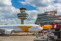 Mongolian Airlines Boeing B767 at the Gate in Berlin Tegel - Germany Mongolian Airlines Boeing B767 at the Gate in Berlin Tegel - Germany