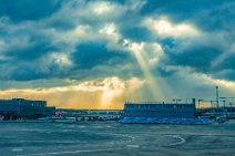 Cloudy sky and sun beams over Frankfurt Airport - Germany Cloudy sky and sun beams over Frankfurt Airport - Germany.jpg