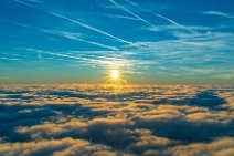 Vapor trails and sunset above a cloud layer 02 Vapor trails and sunset above a cloud layer 02.jpg