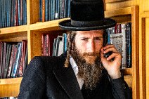 Orthodox Jew at a book shelf - Jerusalem - Israel Orthodox Jew at a book shelf - Jerusalem - Israel
