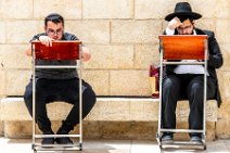 Two Jewish men reading in the Prayer Book - Western Wall - Jerusalem - Israel Two Jewish men reading in the Prayer Book - Western Wall - Jerusalem - Israel