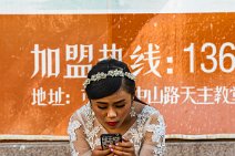 Bride texting on her mobile phone - Qingdao - China Bride texting on her mobile phone - Qingdao - China.JPG
