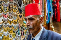 Man with red fez and water pipe - Chan El Chalili bazaar - Cairo - Egypt 02 Man with red fez and water pipe - Chan El Chalili bazaar - Cairo - Egypt 02