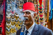 Man with red fez and water pipe - Chan El Chalili bazaar - Cairo - Egypt 07 Man with red fez and water pipe - Chan El Chalili bazaar - Cairo - Egypt 07