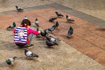 Child feeding pidgeons - Krakow - Poland Child feeding pidgeons - Krakow - Poland.jpg