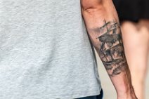 Sailboat tattoo on an arm Sailboat tattoo on an arm