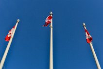 Three masts with Canada flags - Vancouver - Canada Three masts with Canada flags - Vancouver - Canada