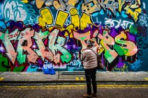 Woman viewing a graffiti - Notting Hill - London - United Kingdom 02 Woman viewing a graffiti - Notting Hill - London - United Kingdom 02