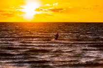Kite surfer during sunset - western beach in Grossenbrode - Germany 01 Kite surfer during sunset - western beach in Grossenbrode - Germany